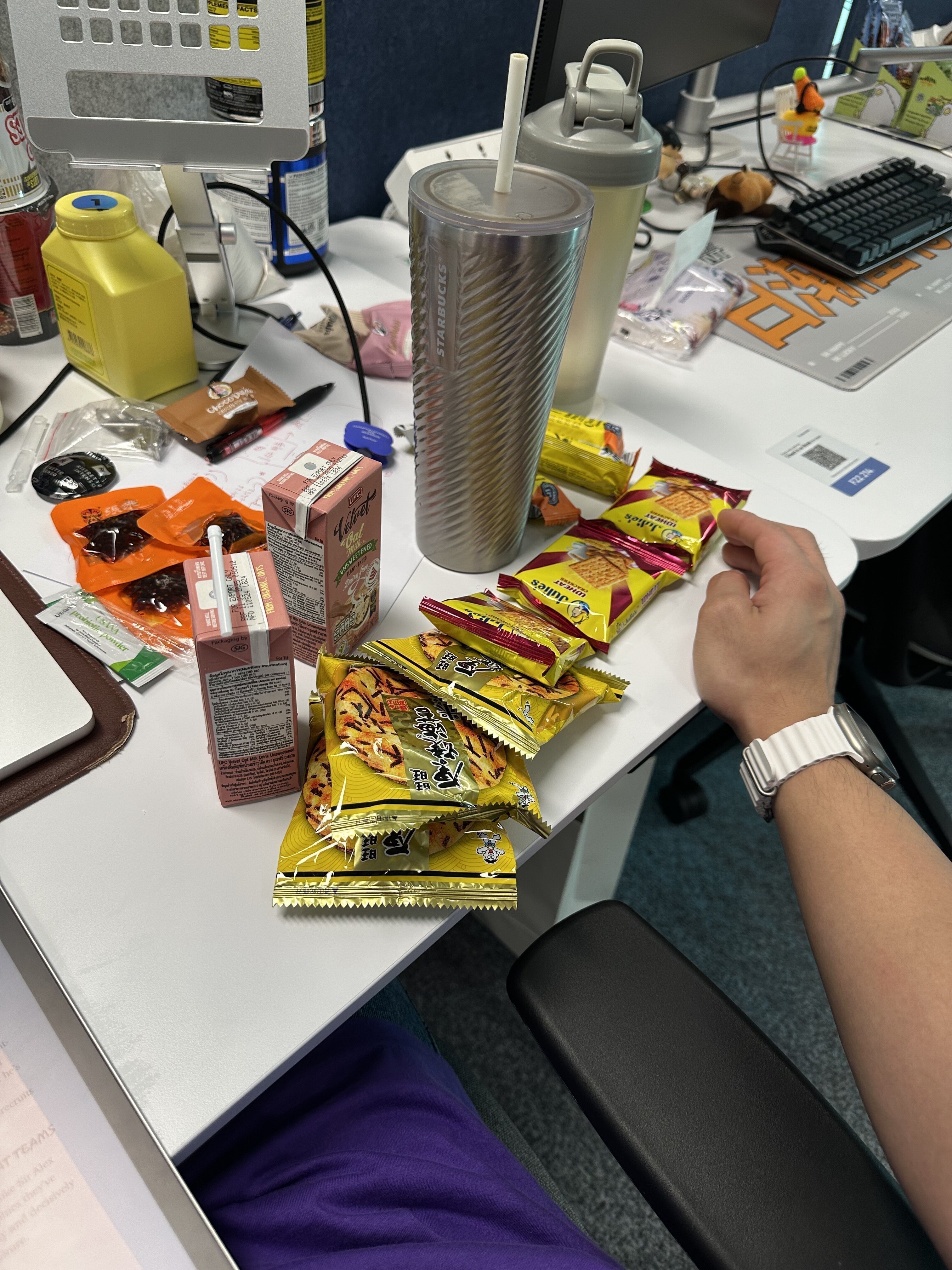 snacks all over my desk, productivity fuel or distraction?